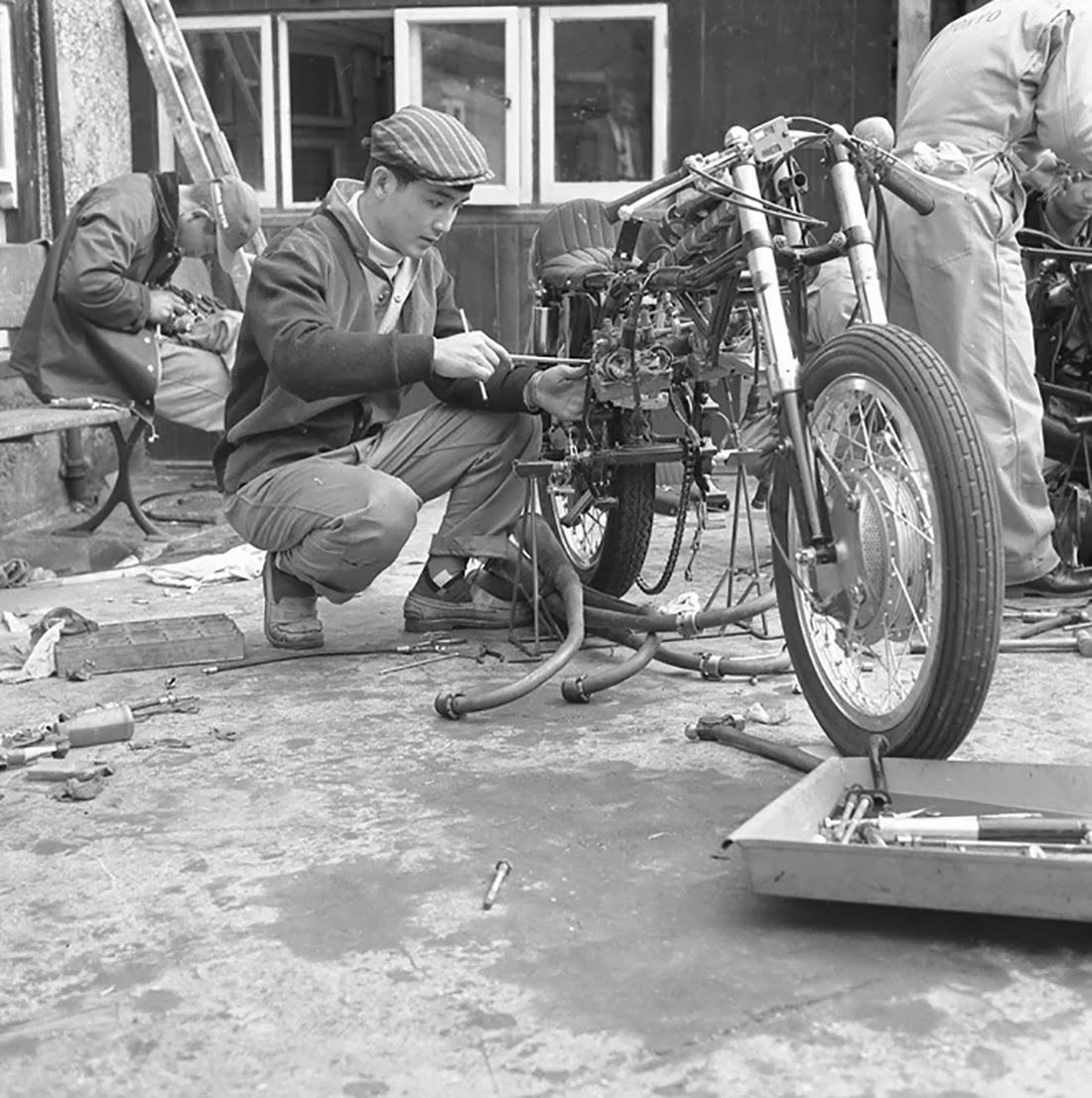 mechanic working on a #honda during 1962 #IOMTT mechanic working on a #honda during 1962 #IOMTT